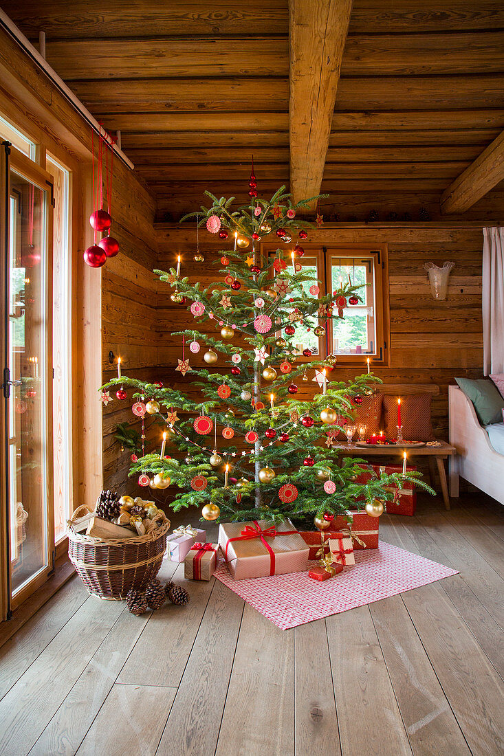 Christmas tree decorated with small embroidery frames and gifts