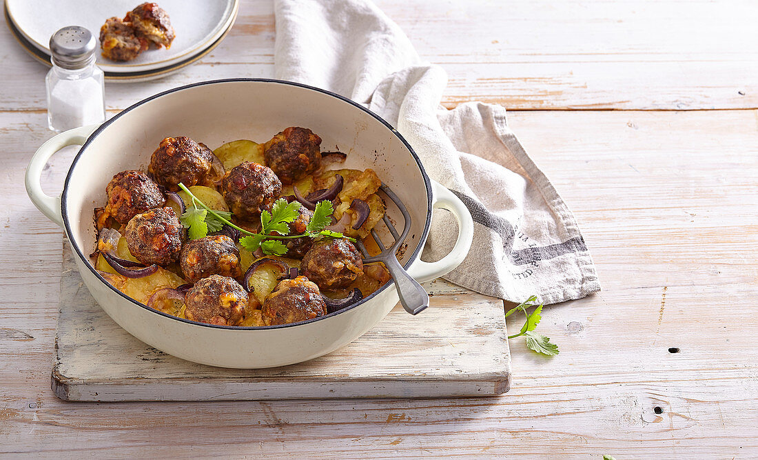 Beef meatballs with chorizo and cheese on a bed of potatoes