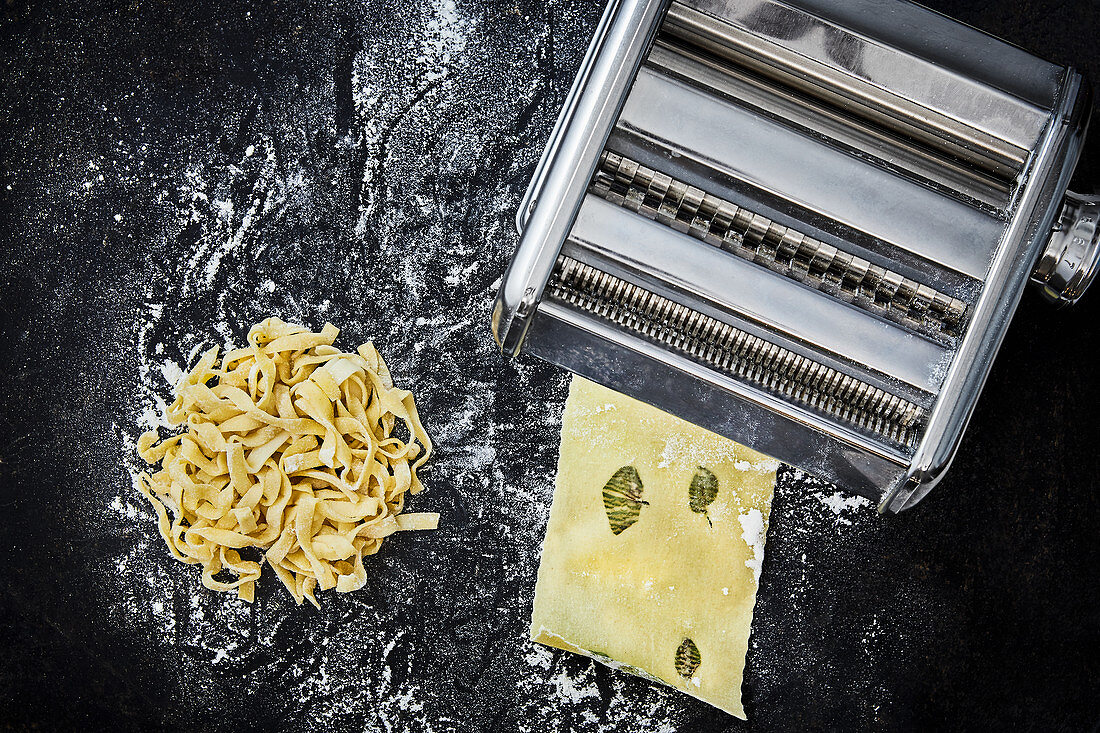 Homemade ribbon noodles and lasagne sheets with sage and a pasta machine