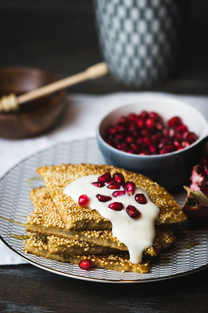 Millet pancakes with pomegranate seeds
