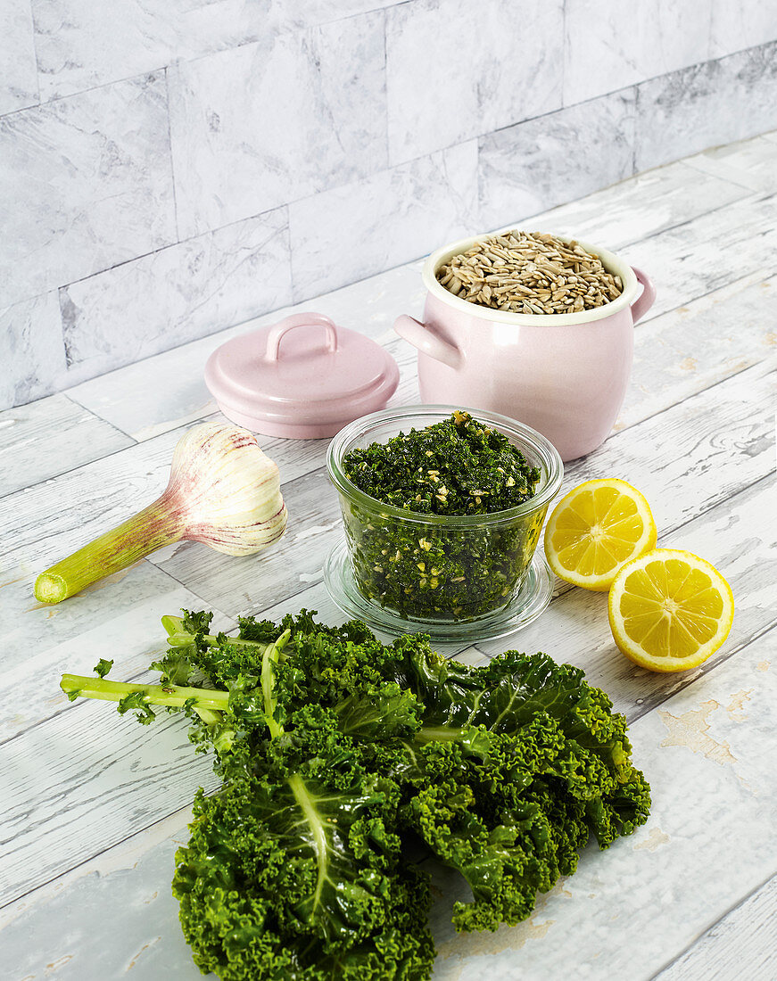 Kale pesto in a glass with various ingredients