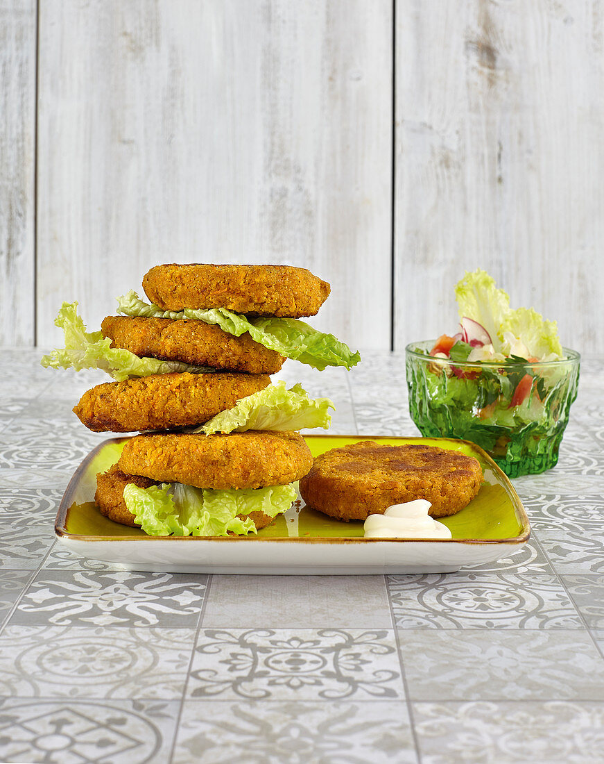 Millet patties with salad and mustard sauce