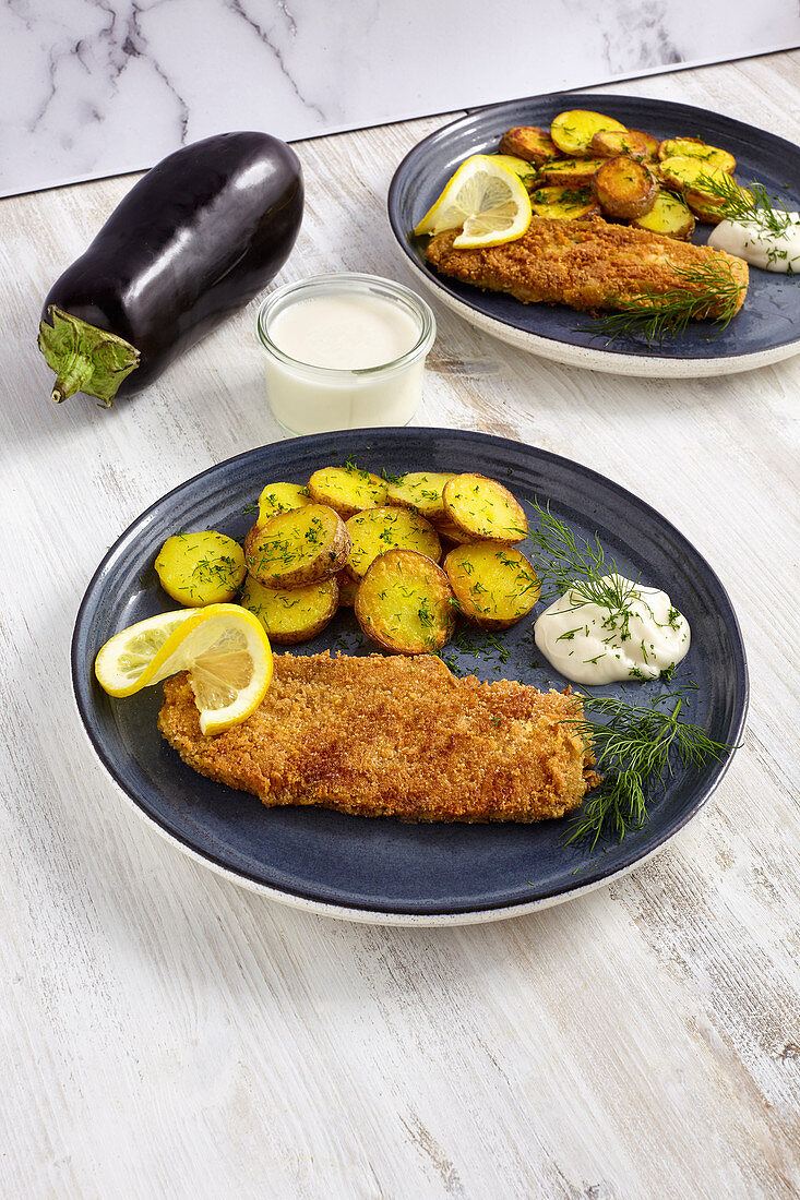 Eggplant schnitzel with fried potatoes and mayonnaise