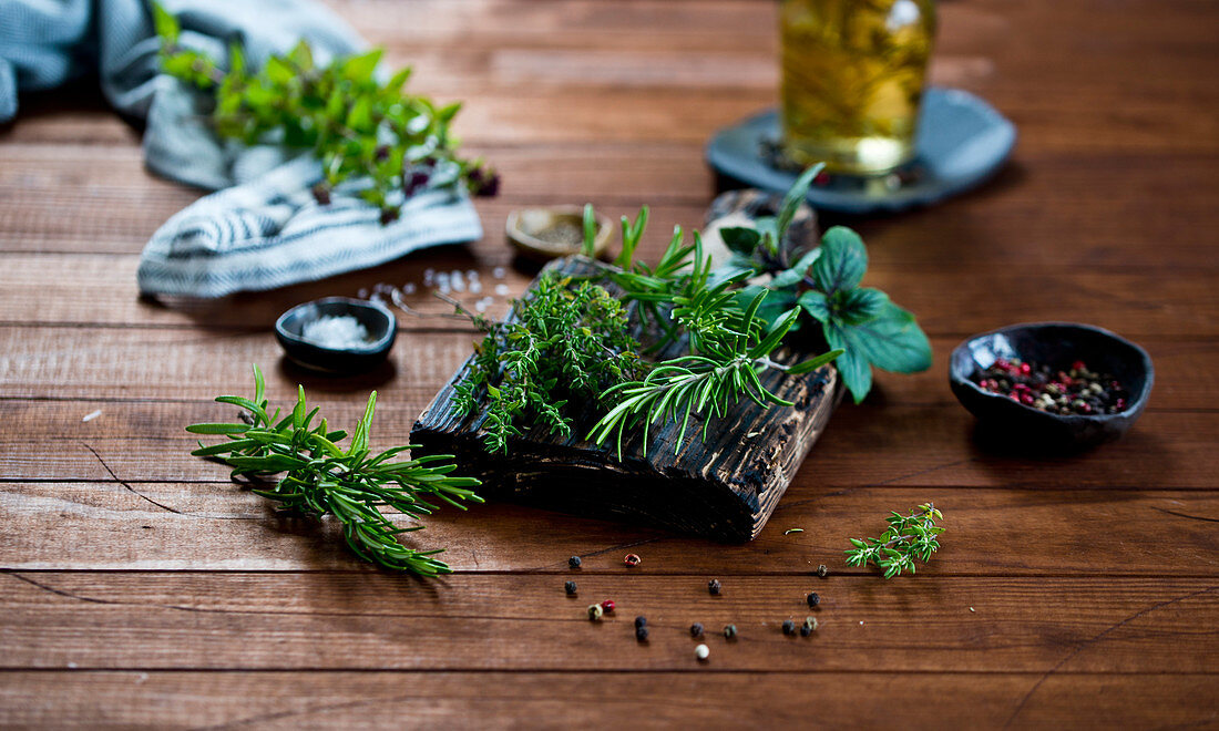 Fresh herbs on a wooden cutting board