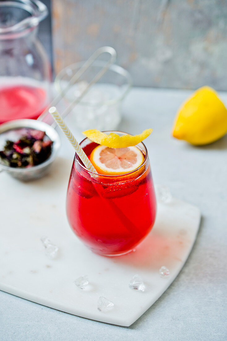 Homemade iced tea with a lemon wedge in a glass