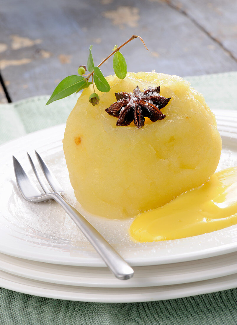 Poached apple with vanilla sauce and star anise