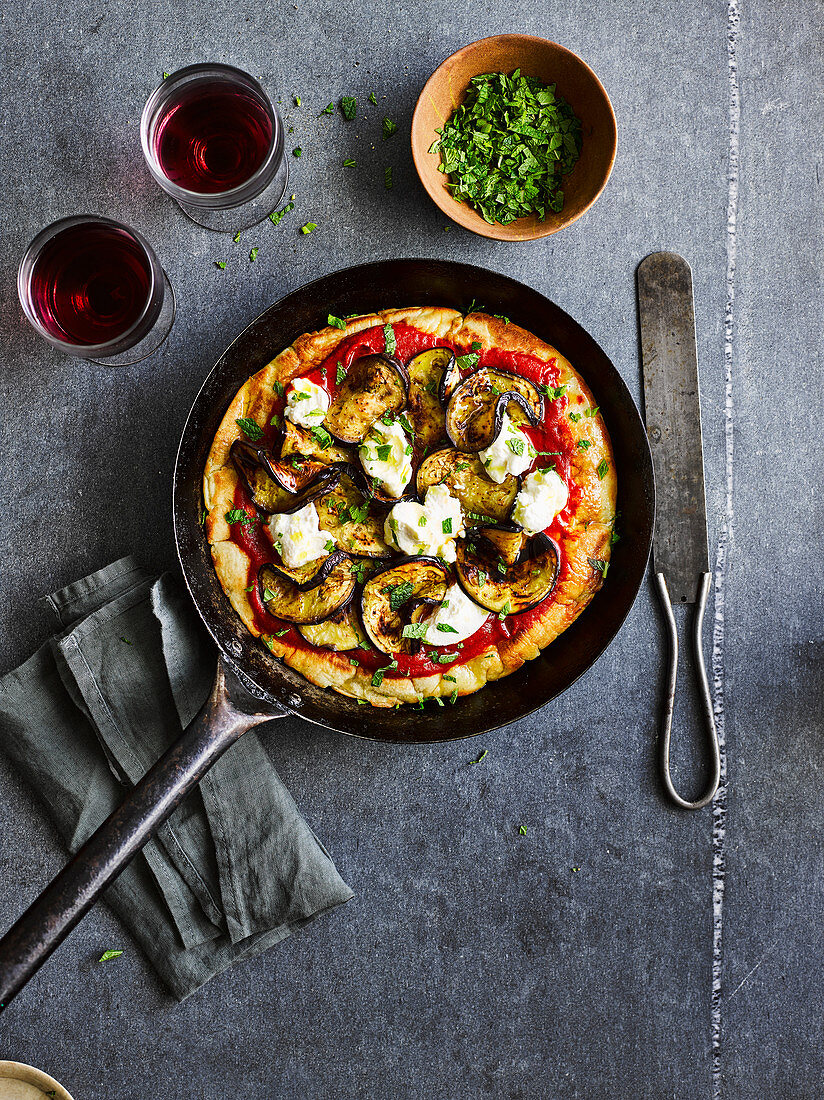 Frying pan pizza with aubergine, ricotta and mint