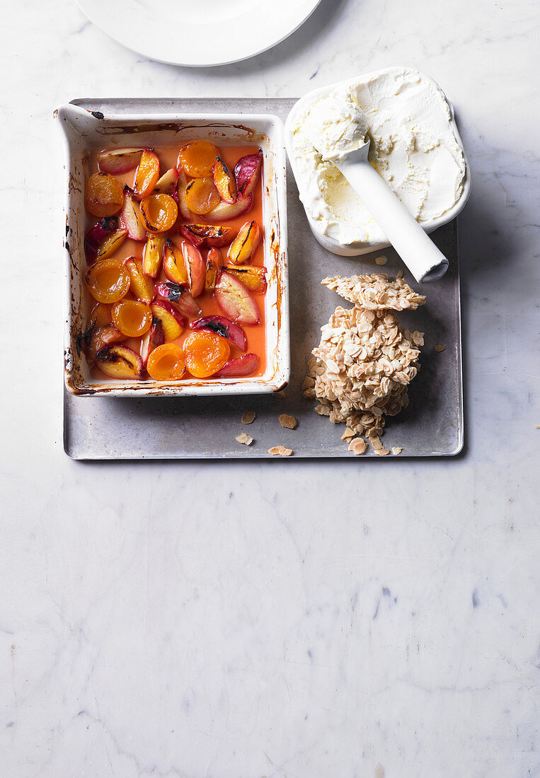 Roasted stone fruits with ice cream