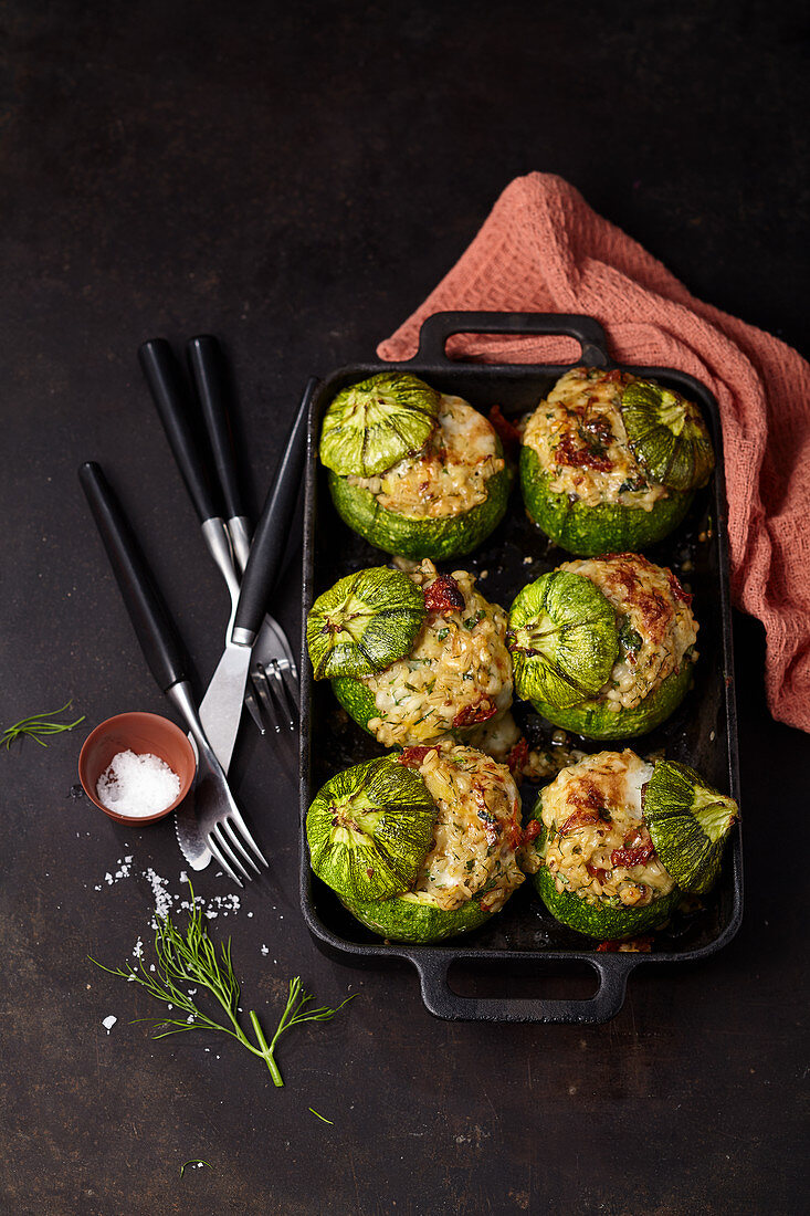 Baked zucchini with pearl barley filling