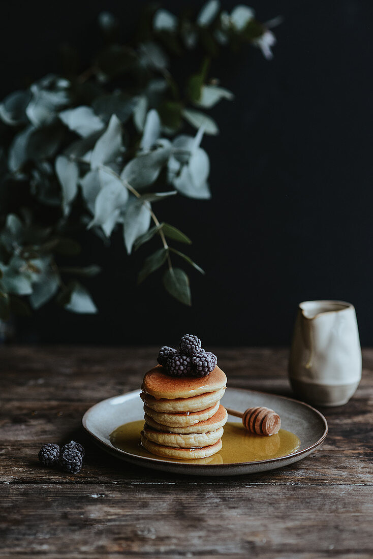 Mini American pancakes with blackberry and maple syrup