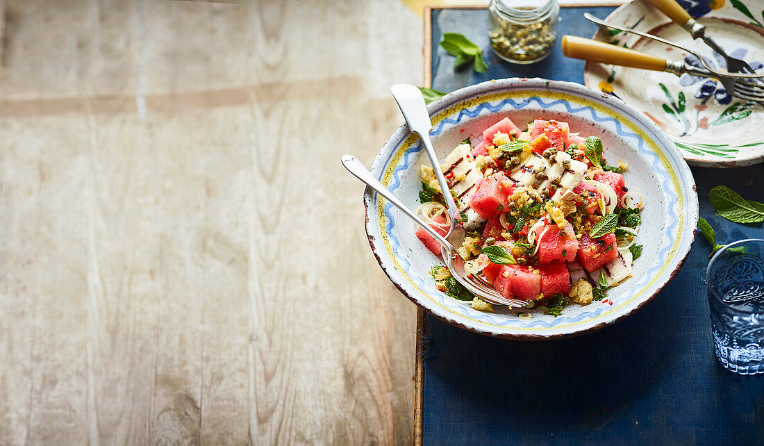 Watermelon salad with grilled halloumi, capers and breadcrumbs