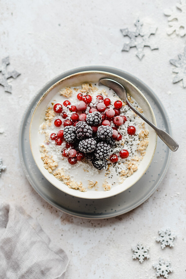 Winter porridge with red currants and blackberries