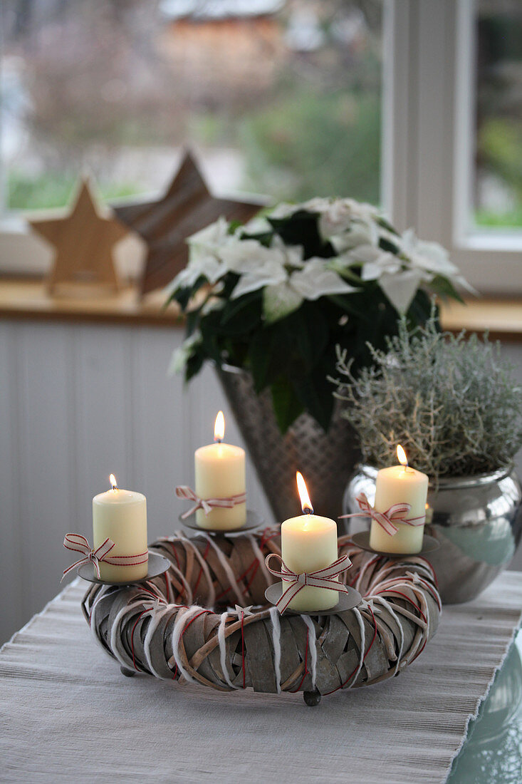 Advent wreath with poinsettia and ragwort