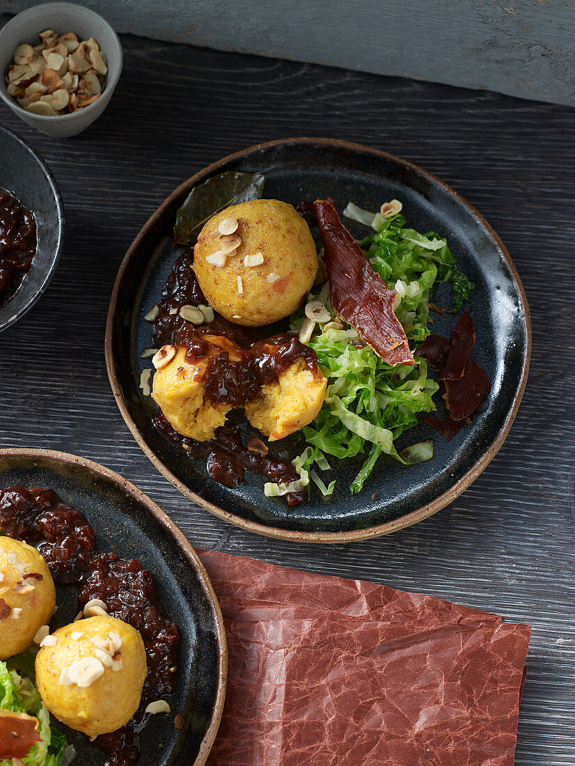 Parsnip dumplings with spiced plum sauce