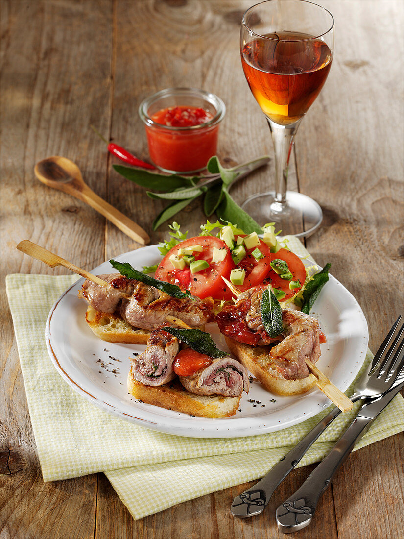 Saltimbocca skewers with apricot and raspberry sauce