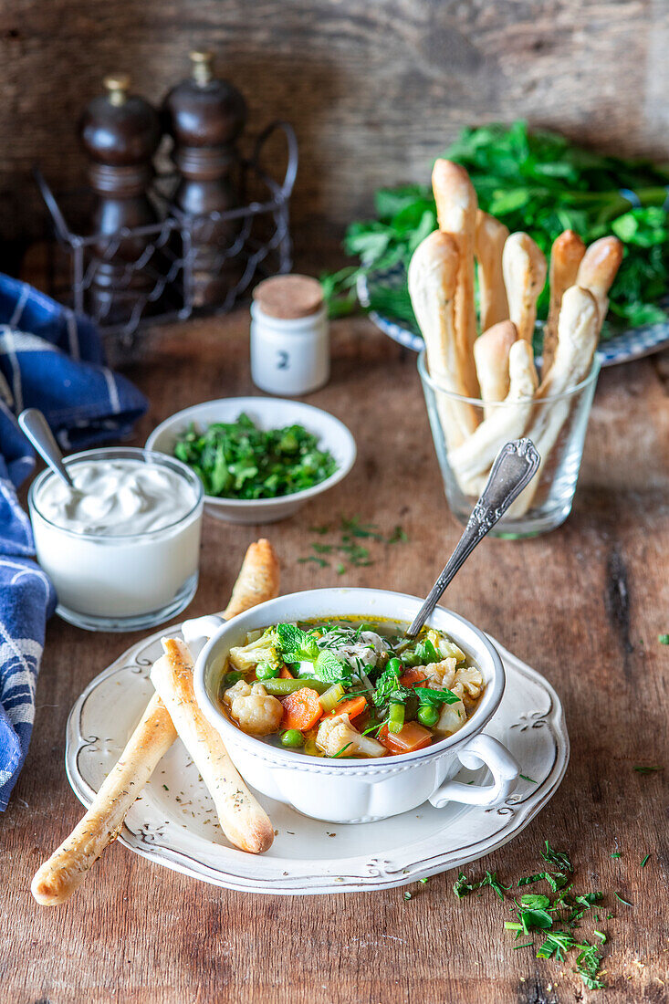 Vegetable soup with bread sticks