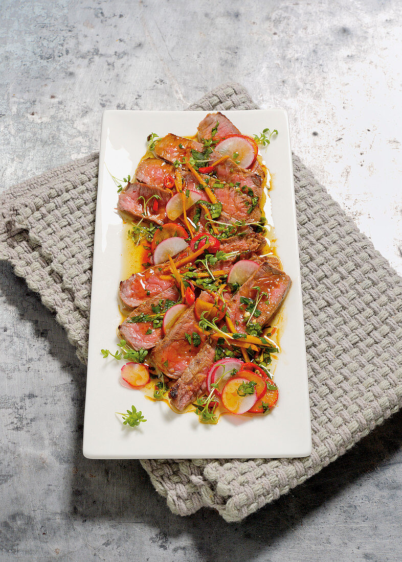 Beef rump steak carpaccio with a ginger and chilli marinade