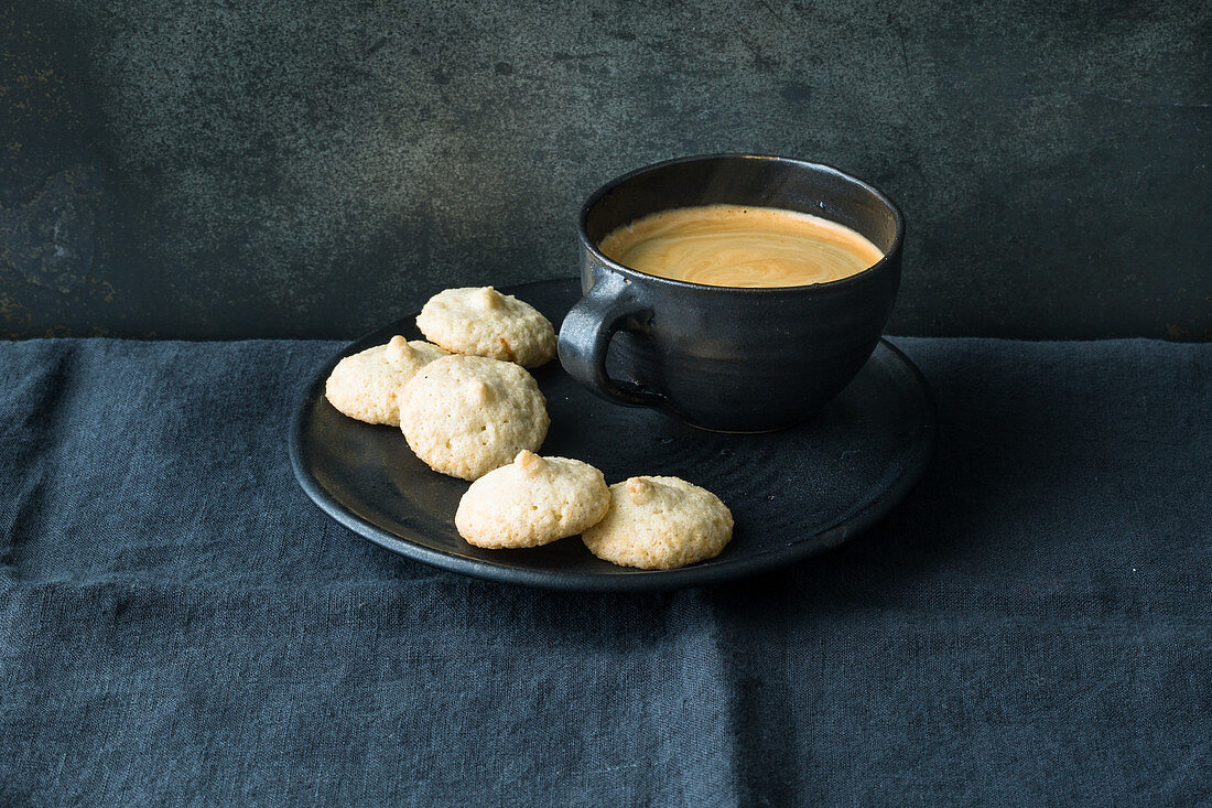 Gluten-free amaretti with a cup of coffee