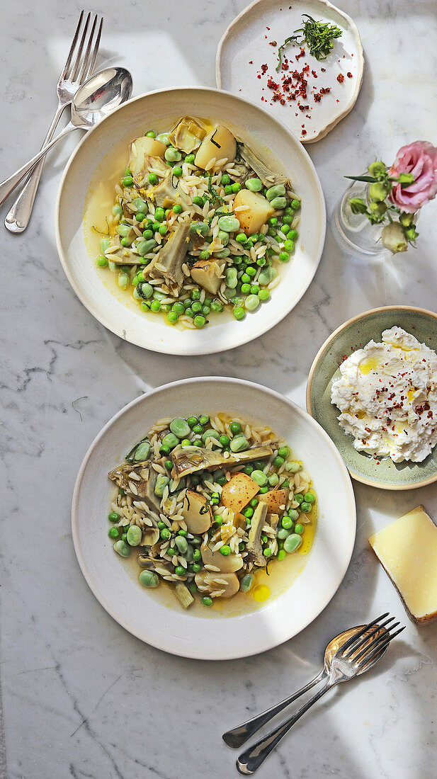 Spring vegetable orzo with broad beans, peas, artichokes and ricotta