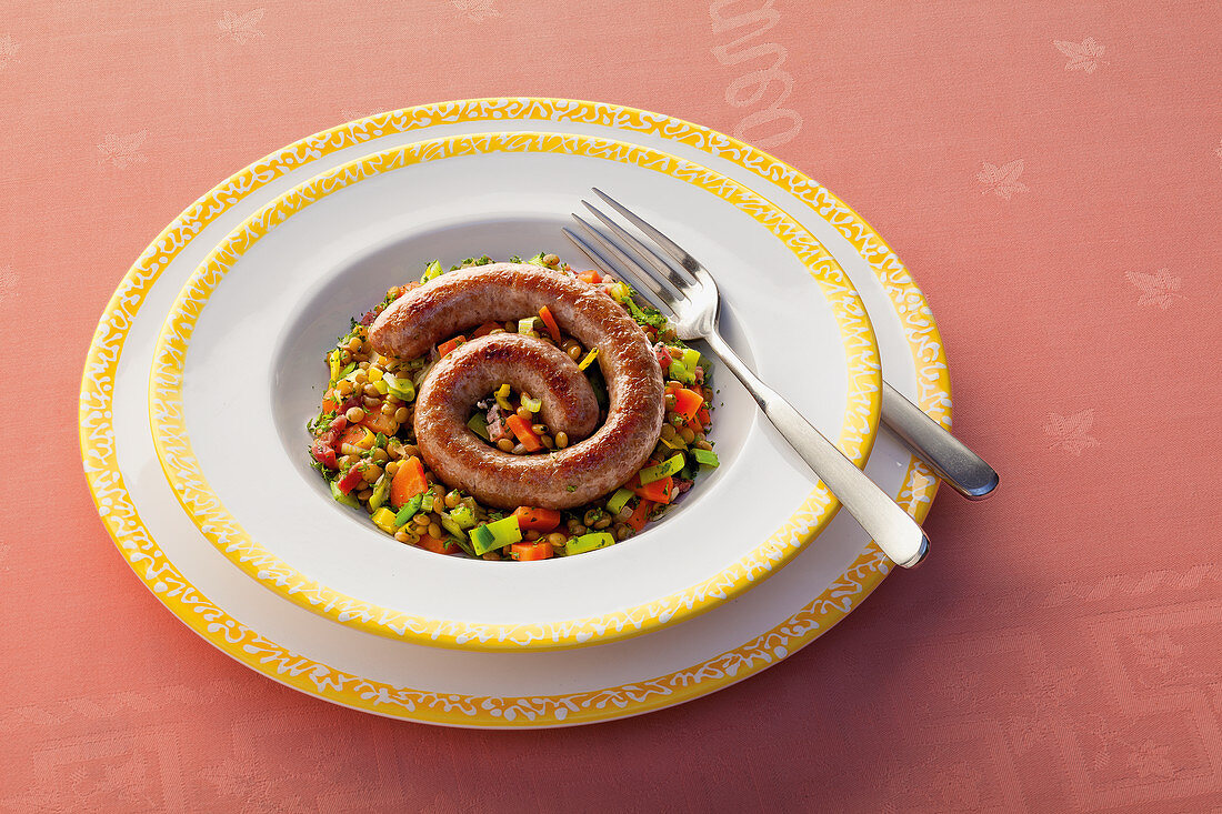 Venison sausages with lentils and vegetables