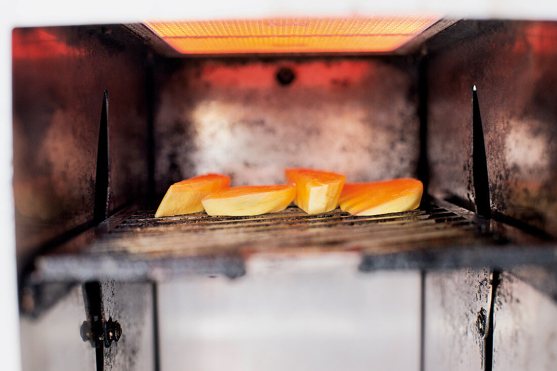 Mango being grilled in a Beefer