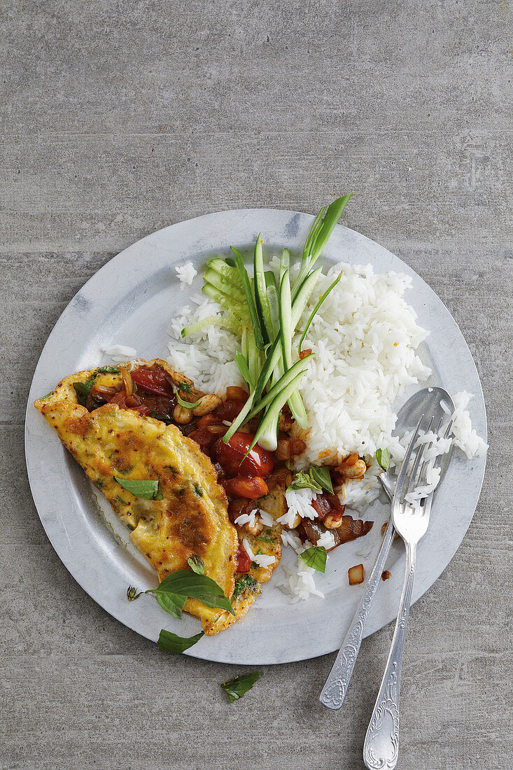 Spicy omelette on rice with Thai basil