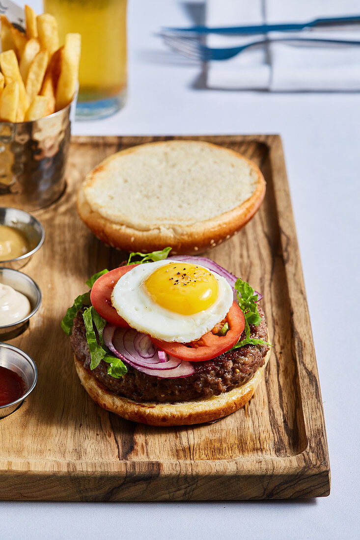 A beef burger with a quail's egg