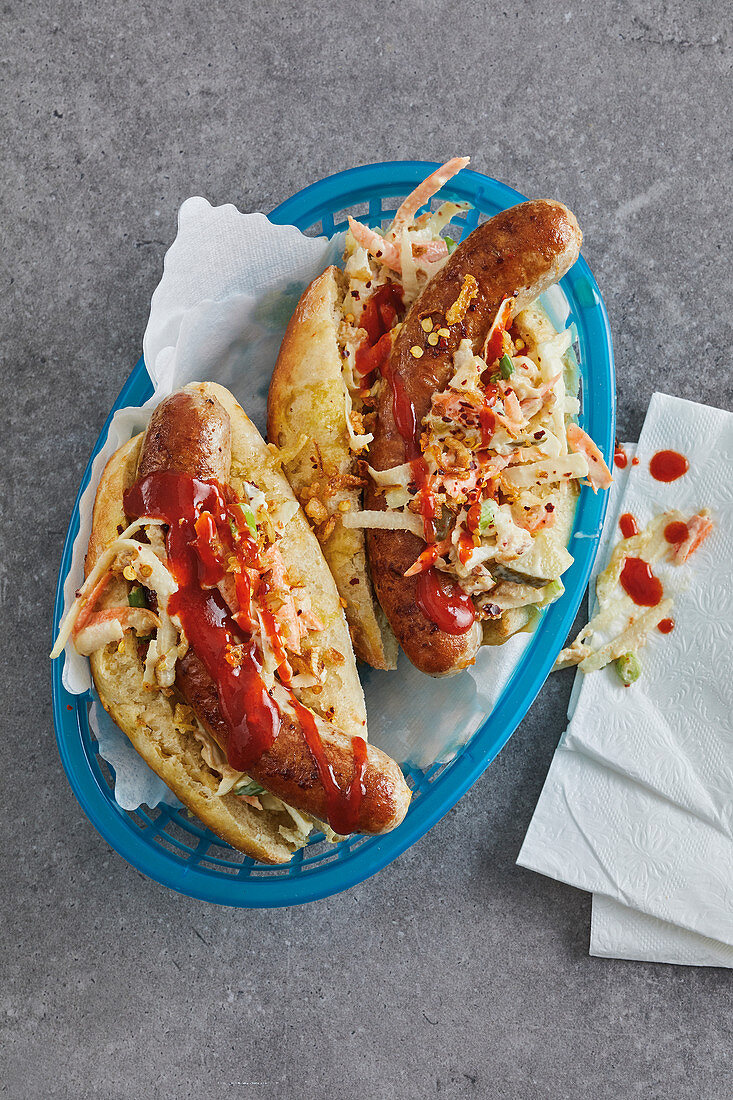 Sausages in sweet rolls with a spicy Bandung salad