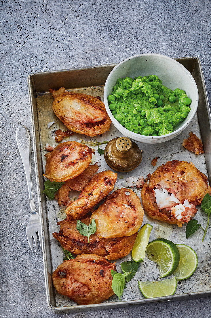 Cod fillet in a crispy tandoori coating with mushy peas and mint