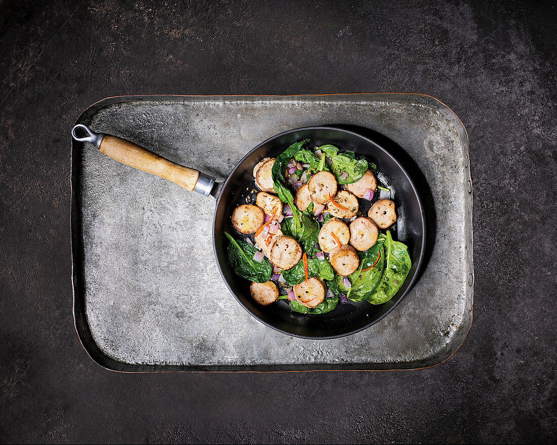 Fried lamb testicles with spinach and lemon pepper