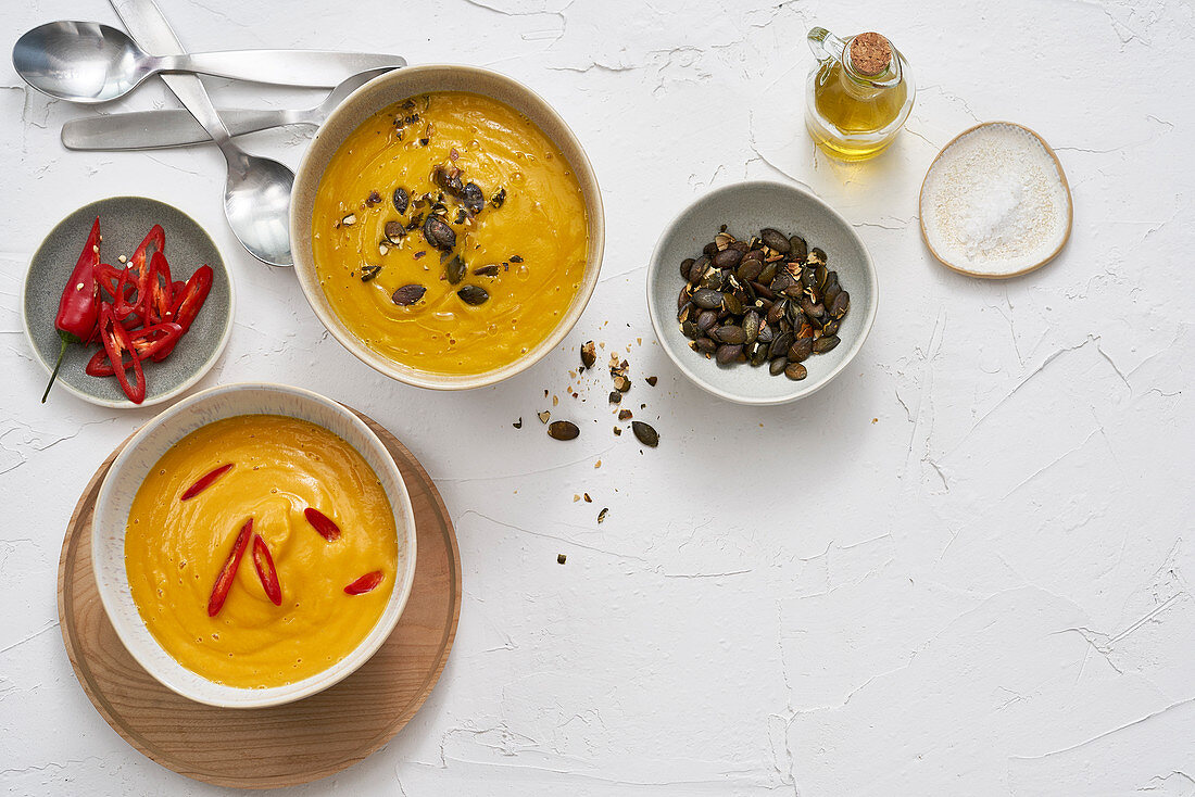 Cauliflower and carrot soup and curry-sweet potato soup