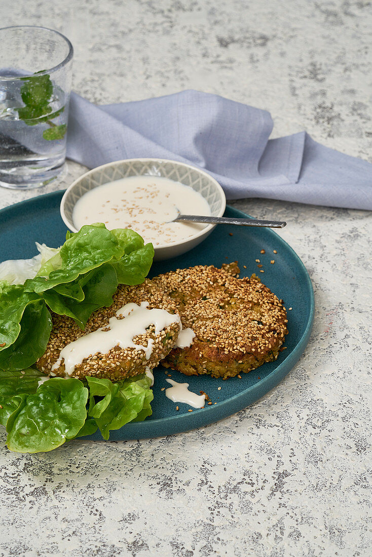 Carrot and chickpea burgers with tahini sauce