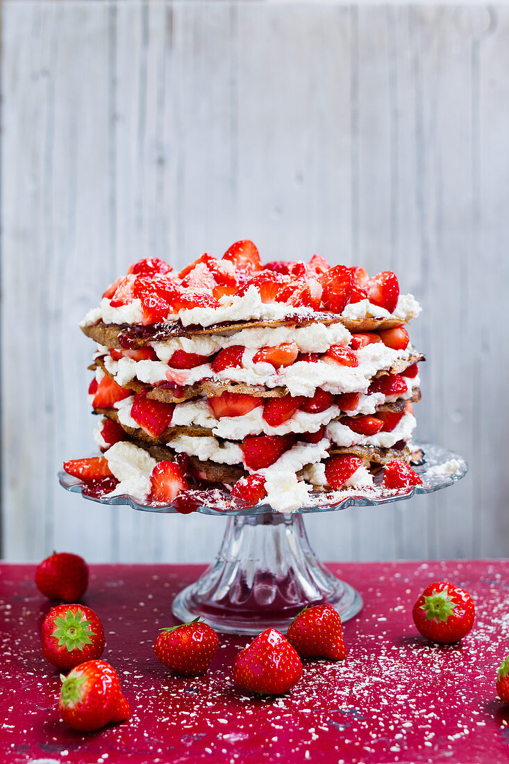 Pancake cake with plant-based cream and strawberries (vegan)