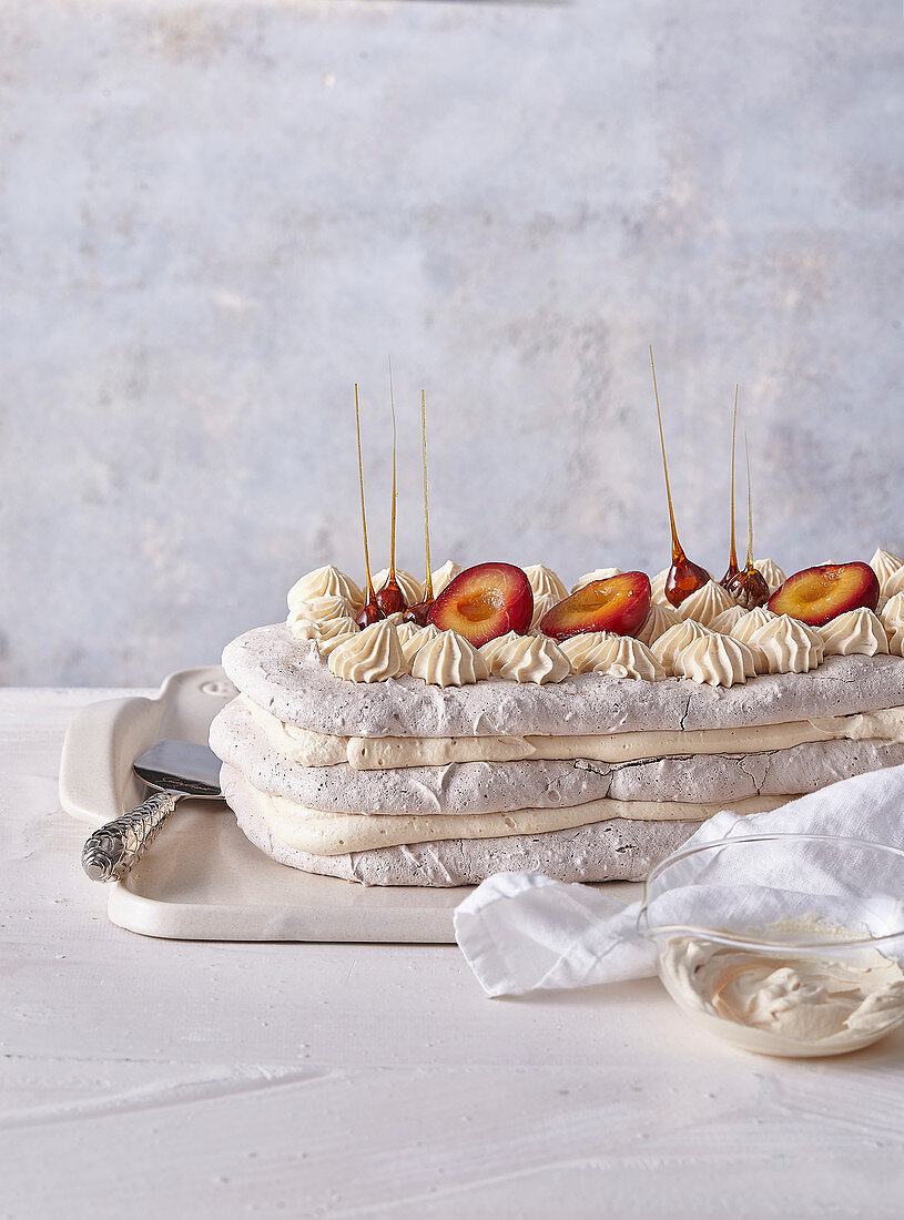 Walnut meringue with plums