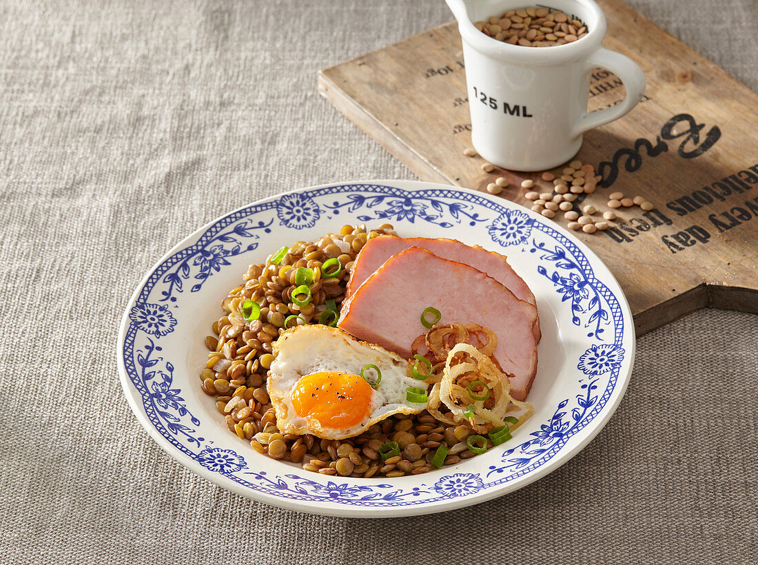 Sour lentils with smoked meat and egg