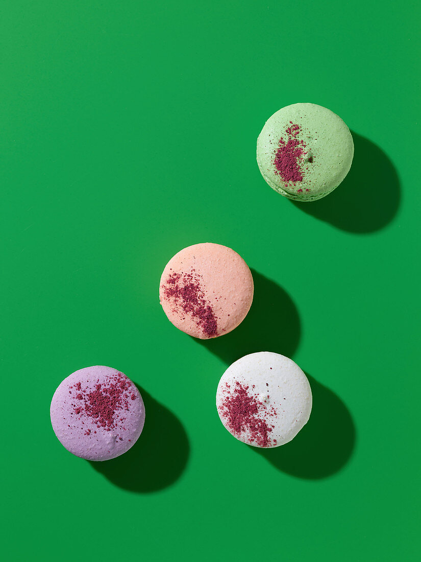 French macaroons decorated with colorful food powders