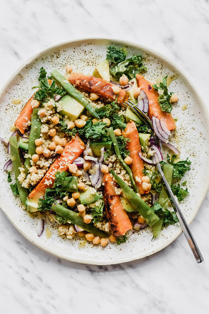 Salad with millet kale roasted carrots avocado beans and chickpeas