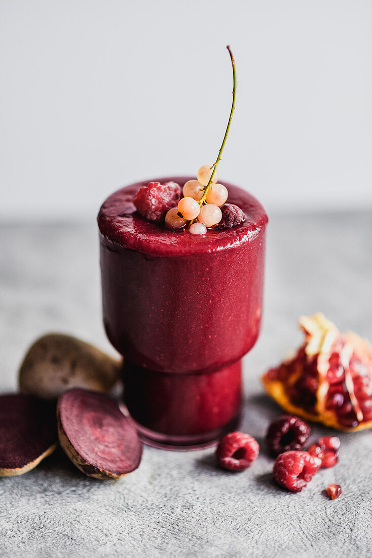 Beetroot smoothie with raspberries pomegranate and currants