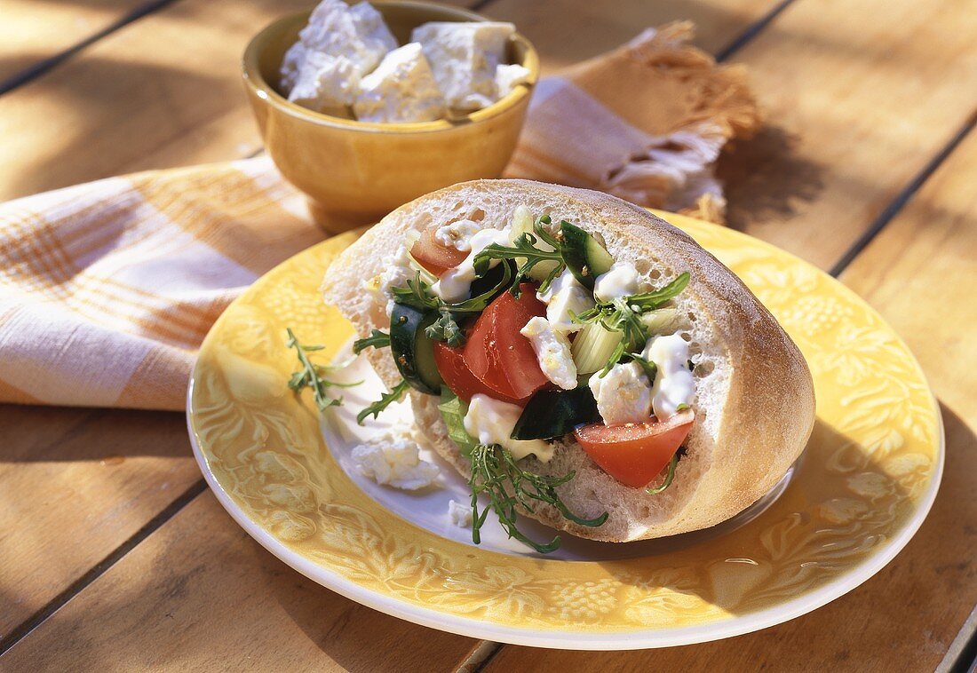 White bread filled with vegetables & sheep's cheese