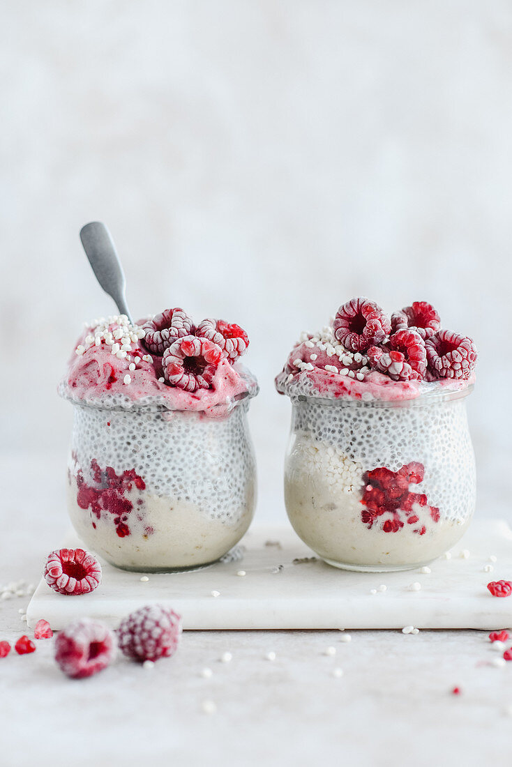 Chia pudding with expanded millet and frozen raspberries