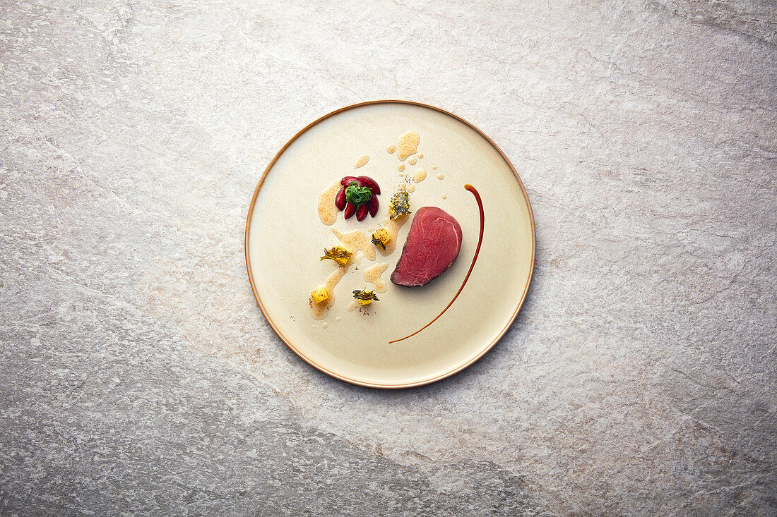 Pork fillet with apple, cherry and fried algae