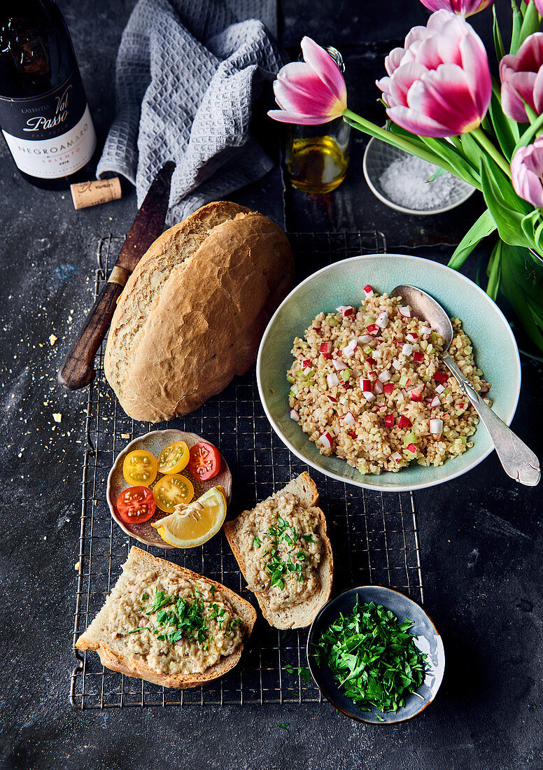 Bread with an aubergine spread and a couscous and radish salad