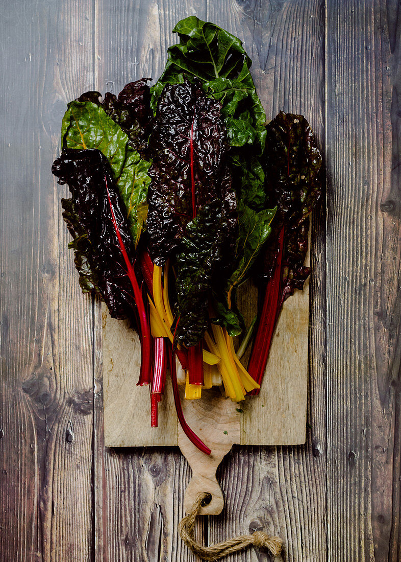 Colorful rainbow swiss chard on a wooden board