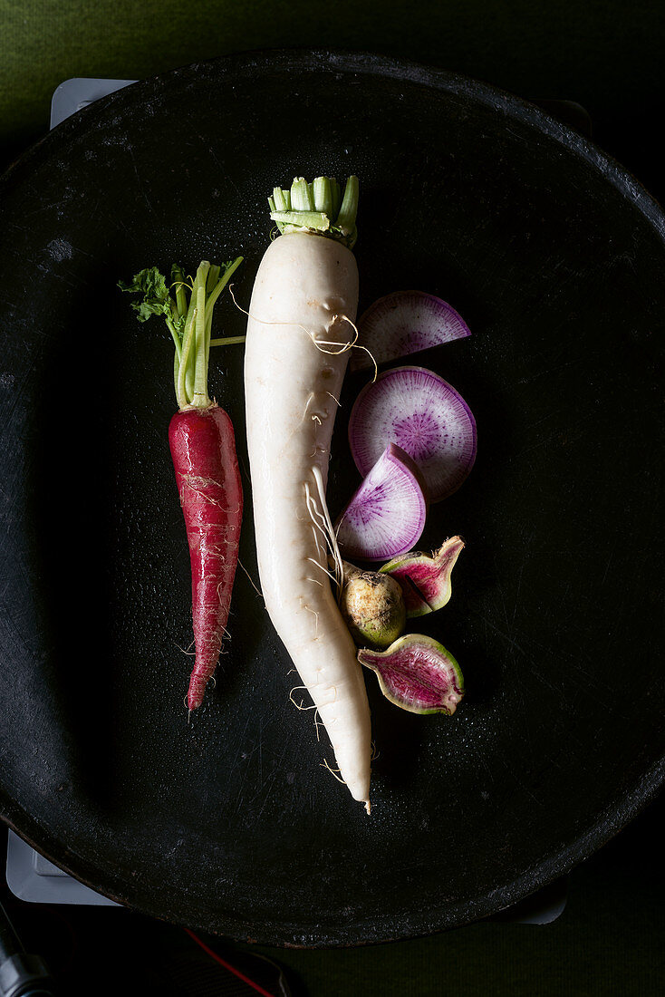 An assortment of red, white, Japanese, daikon radishes