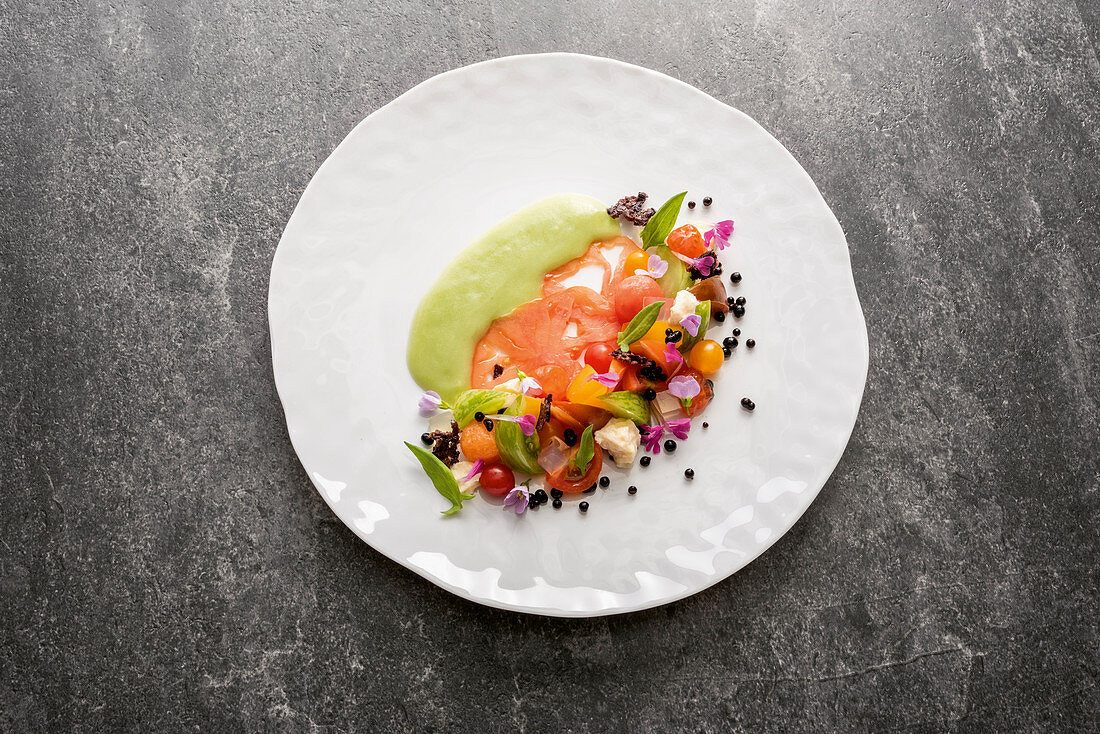 Vintage tomato salad and crunchy olive topping