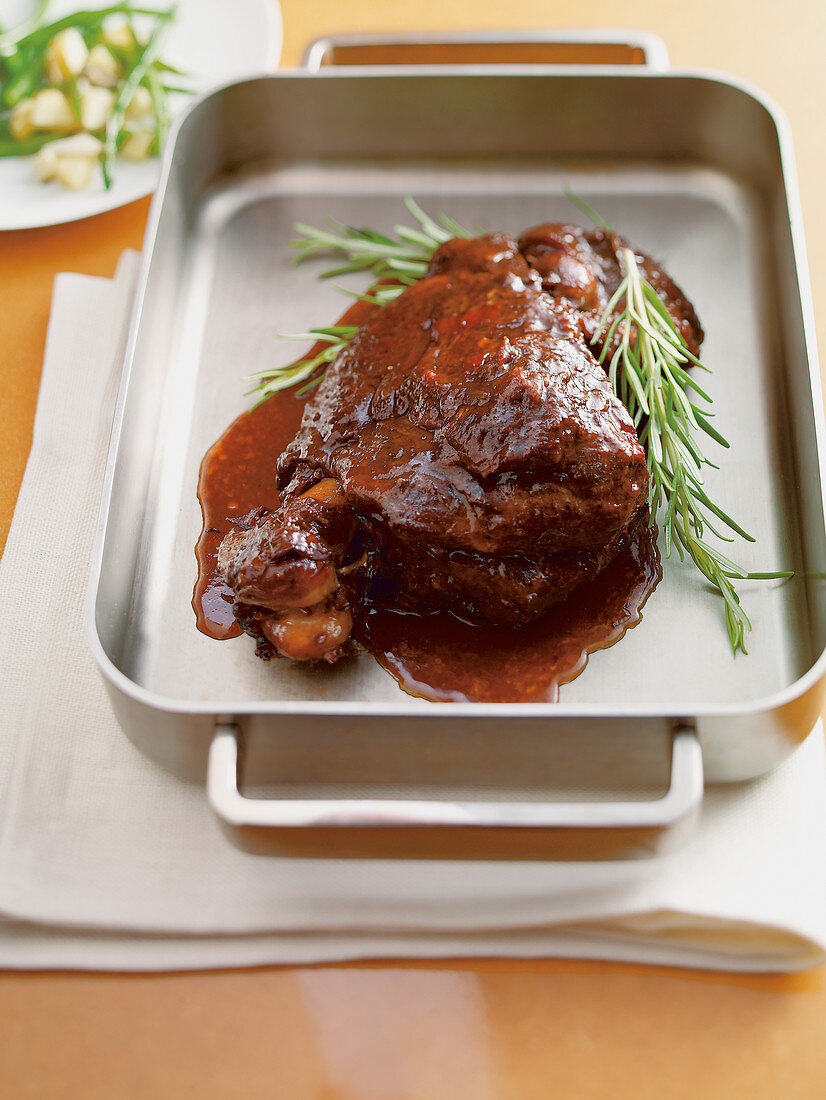 Tender cooked lamb with red wine, dried apricots and rosemary