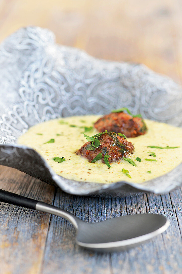 Cheese and leek soup with meatballs