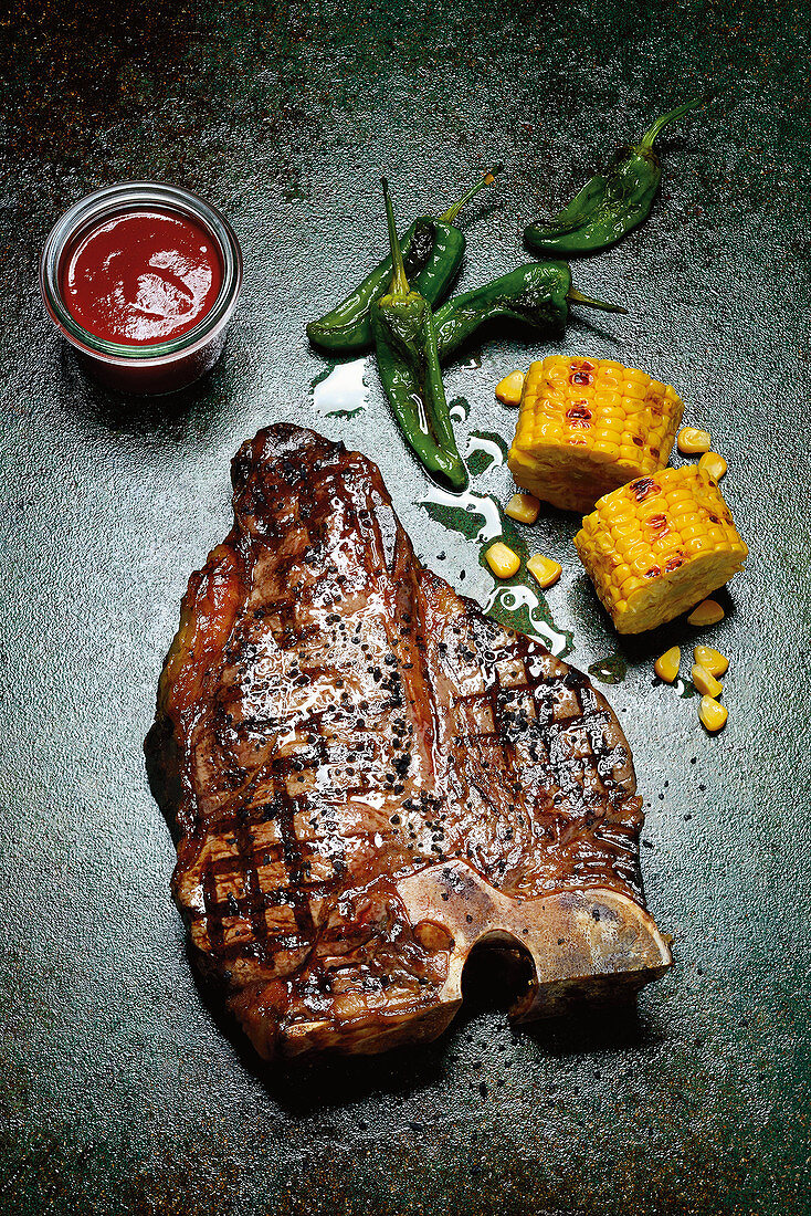 Grilled porterhouse steak with corn on the cob