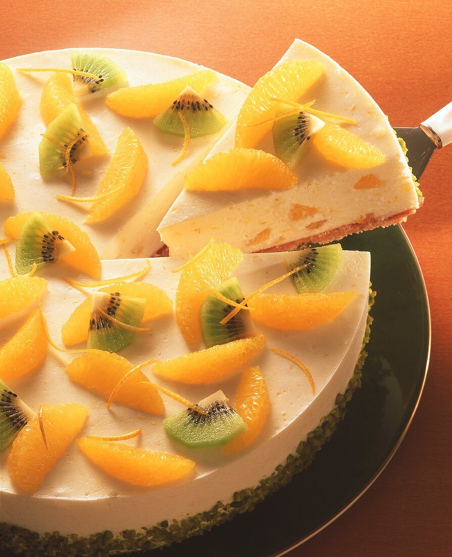 Orange cheesecake with orange segments & kiwi pieces
