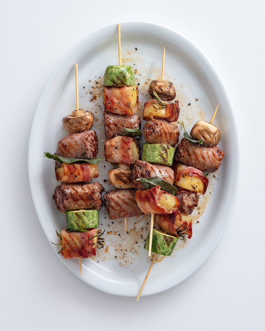 Grilled sausage skewers with mushrooms, provolone and zucchini